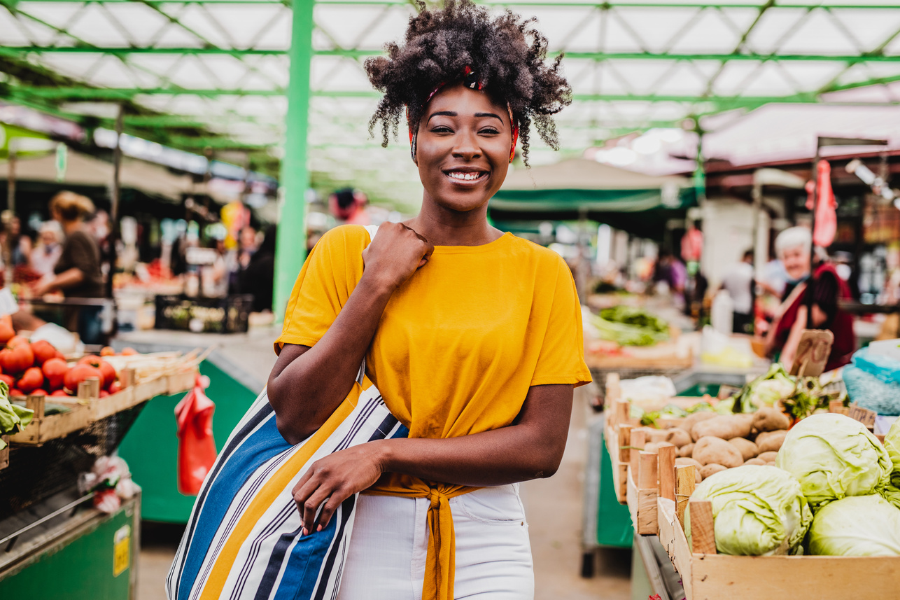 Young African woman on a farmers market